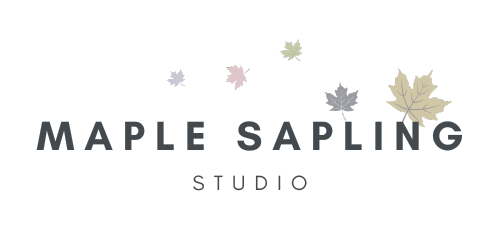 logo reads Maple Sapling Studio in dark font with a scattering of maple leaves